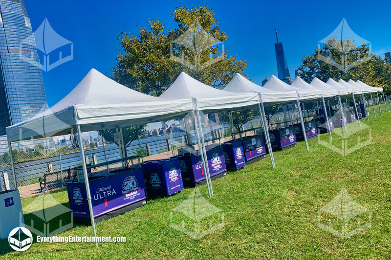 row-of-festival-tents 10x10 Festival Tents setup in row with Manhattan skyline in background.