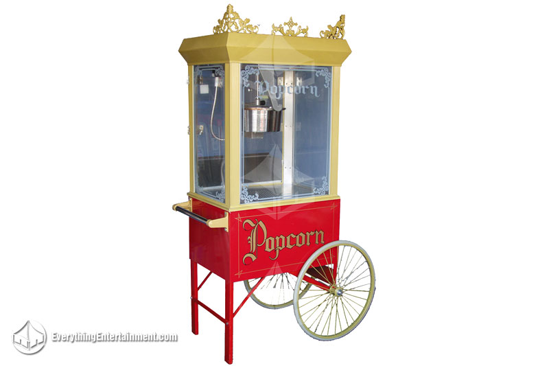 Popcorn wagon Gold popcorn machine and red wagon with wheels on white background.