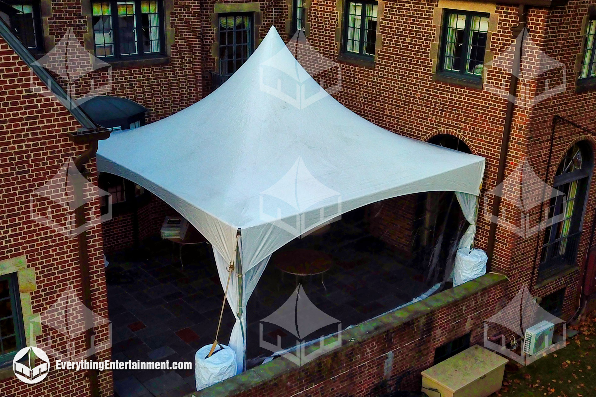 20x20-high-peak-marquee-tent-rental-setup 20x20 high peak marquee tent setup on a residential deck for an outdoor event