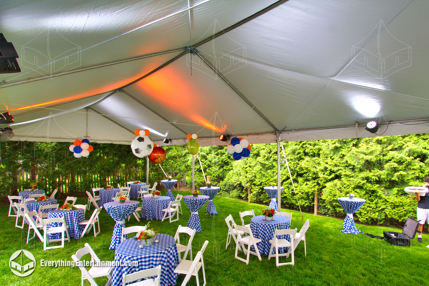 20x50-tent-interior Interior of a 20x50 frame tent on grass, with garden chairs and tables