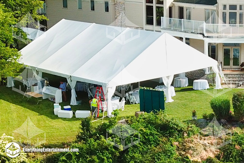 40x45-frame-tent 40x45 foot wedding tent setup in backyard with house in background