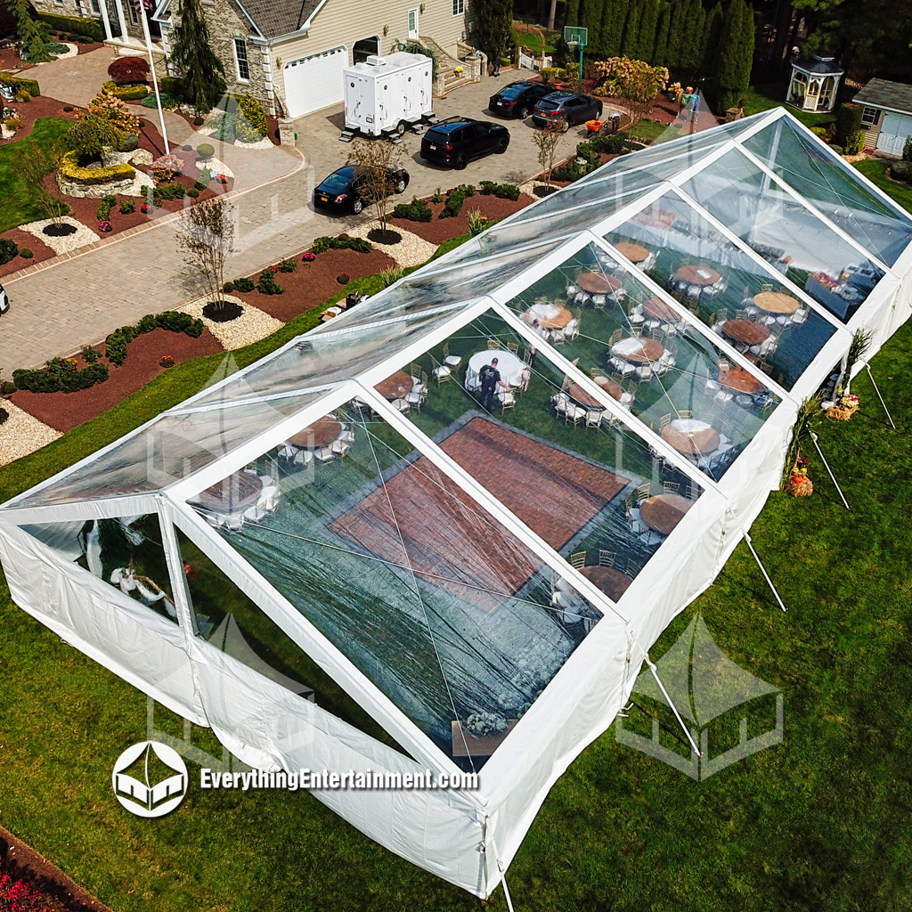 Clear Top Wedding Tent aerial view Aerial view of a large clear top wedding tent in backyard.