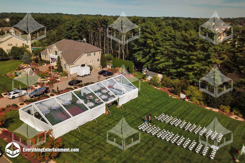 40x90-clear-top-frame-tent 40x90 clear top frame tent setup on grass for backyard wedding