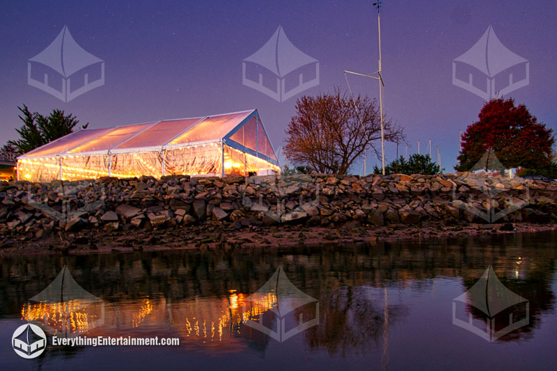 50x60 Frame Tent Clear top wedding tent at night with reflection in the water