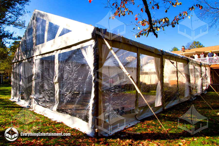 Clear Tent Sidewalls Clear tent sidewalls on a large 30x60 foot frame tent setup on grass with f