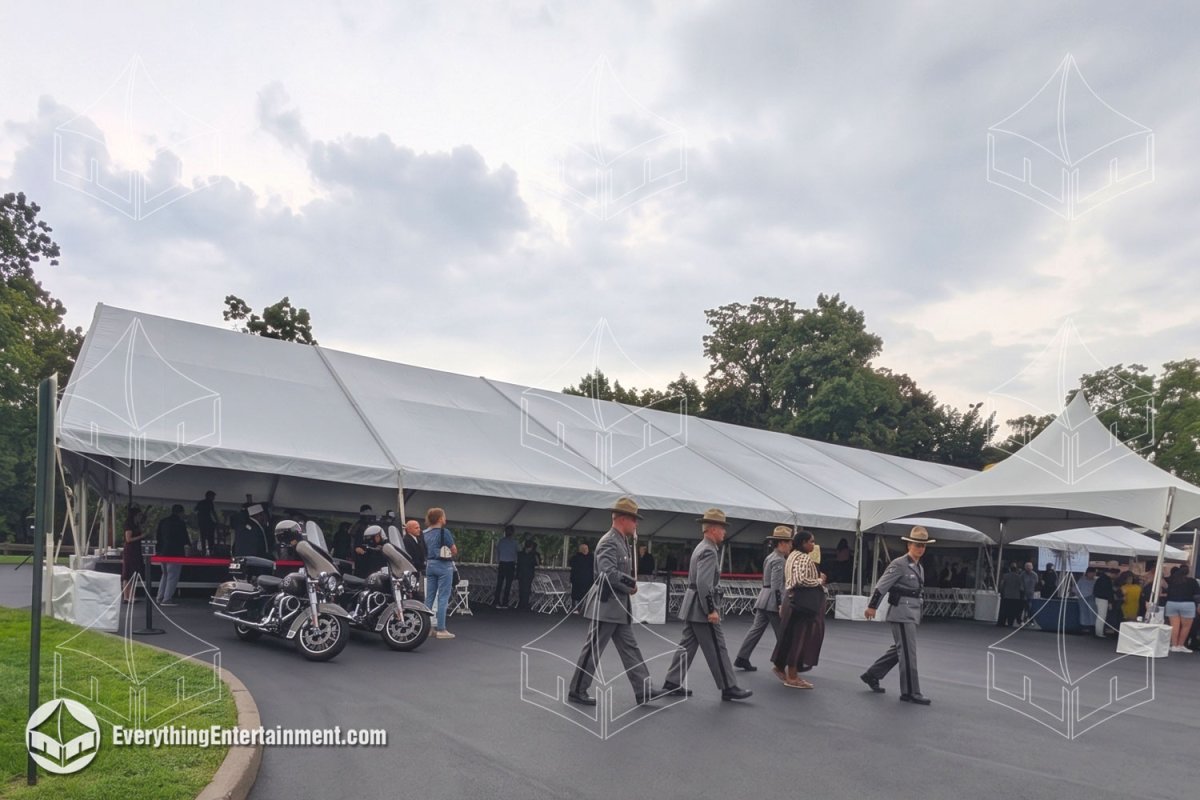 Large 50x105 main frame tent and high peak marquee with police escort motorcycles at West Point Military Academy by Everything Entertainment.