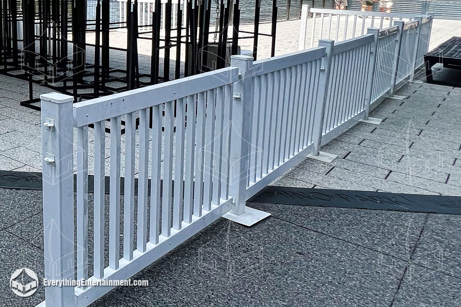 white-picket-fence White picket fence set up on stone tiles